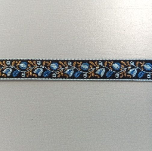 Fekete, kék és arany mintás szalag, egy színoldalú.

Szélessége: 1,2 cm